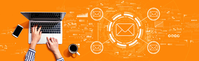 Email concept with person using a laptop computer