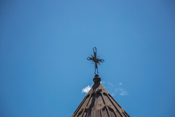 Fototapeta na wymiar Christian cross isolated in blue sky background
