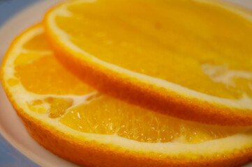 Close-up photo of orange slices in a plate