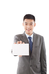 Portrait of young business man holding up blank paper