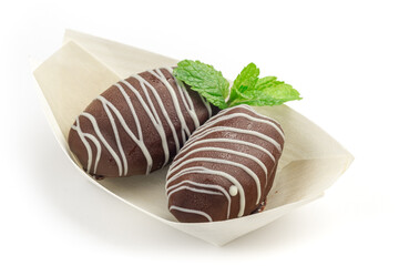 Chocolate covered dates sweet arab candies for dessert, close up