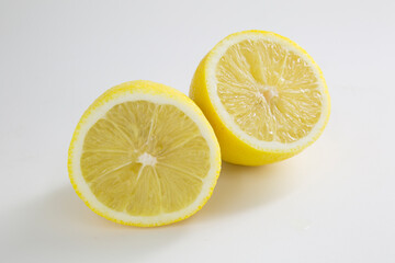 Lemons are yellow on a white background. Citrus fruits.
