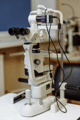 View of the ophthalmic microscope on the table in the ophthalmologist's office. Modern diagnostics and treatment of vision. Diagnostic microscopic medical equipment.