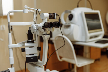 View of the ophthalmic microscope on the table in the ophthalmologist's office. Modern diagnostics and treatment of vision. Diagnostic microscopic medical equipment.