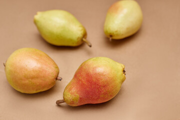 ripe pears on a solid background, close-up