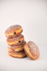 Stack of jelly donuts white background