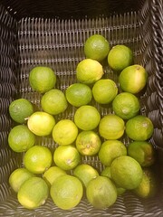 lemons and limes in basket