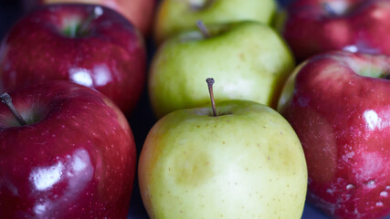 Bright red apples and a green apples