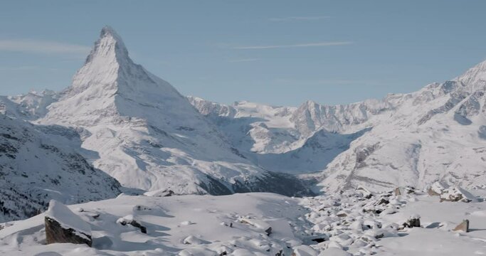 The Matterhorn face east and face north in morning light in winter, Video taken from the hiking trail from Blauherd to Fluhalp, above Zermatt in Valais, Switzerland.
