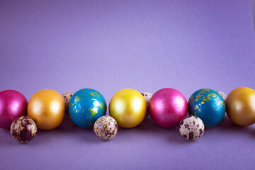 Bright colored eggs on a gray background. Easter theme, holiday. Happy easter card with copy space for text in minimalist easter style. Color of the year. Grey.