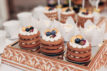 cakes with berries on the mirror spread