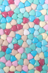 Background of colorful sweet hearts. Background for Valentine's day greeting card. A declaration of love.