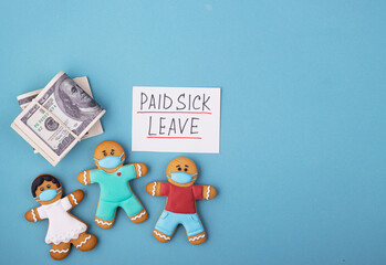 Money and the gingerbread family to mask the inscription of paid sick leave