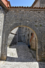 Fototapeta na wymiar An entrance arch in one of the alleys in the medieval town of Morcone in the province of Benevento.