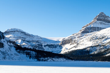 Winter view of mountains surrounding Bow Lake, in Alberta, Canada