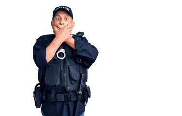 Senior handsome man wearing police uniform shocked covering mouth with hands for mistake. secret concept.