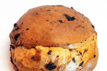 Roll sweet bread with raisins on a white background.