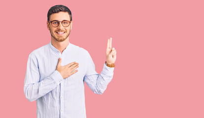 Handsome young man with bear wearing elegant business shirt and glasses smiling swearing with hand on chest and fingers up, making a loyalty promise oath