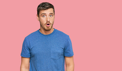 Fototapeta premium Handsome caucasian man wearing casual clothes afraid and shocked with surprise expression, fear and excited face.