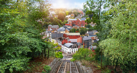 Cityscape of Spa in Belgium. View from up hill with cable car rail.