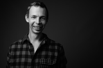 Studio shot of hipster man against gray background