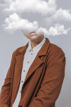 Serene female with her head in the clouds, the concept of  being unrealisticveryday world