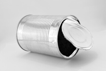 Metal can from under canned food on a gray background.