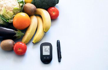 Glucose meter and low glycemic healthy foods for diabetic diet.