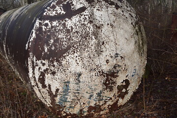 White rust on exterior end of an empty metal tank