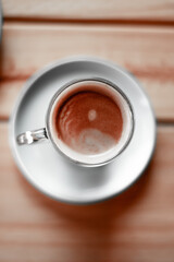 cup of coffee on wooden table