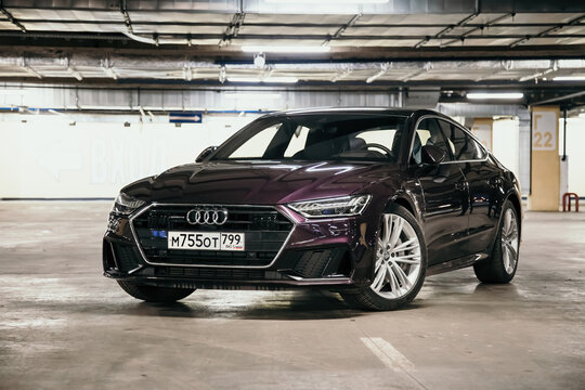 Moscow. Russia - January 16, 2020: Audi A7 Sportback Ultra Nova GT 1 of 111 A purple-colored premium car stands in the parking lot.  Front view