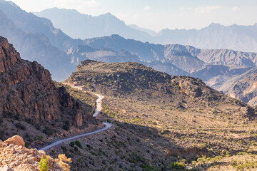 A road passing through the desert mountains of Oman.