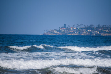 Ocean with city in the background