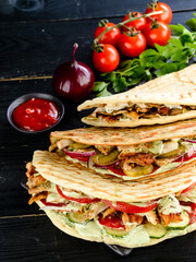 Snack. Takeaway food, street fast food. Pita bread sandwich with fresh vegetables and meat. Kebab in flat cake