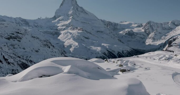 The Matterhorn face east and face north in morning light in winter, Video taken from the hiking trail from Blauherd to Fluhalp, above Zermatt in Valais, Switzerland.
