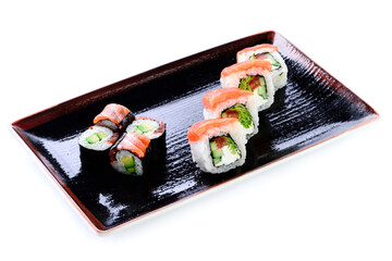 Close-up of traditional Japanese sushi on white background. Design of the sushi bar menu. Japanese cuisine. different versions of sets of sushi rolls maki on plate isolated
