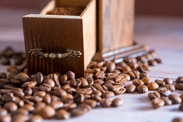 Vintage manual coffee grinder with coffee beans 