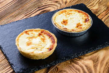 Tartlet pastries. Delicious and healthy range of bakery. hearty tartlets. baked tart pies with cheese, meat, mushroom and dill for sale. Food, gastronomy and pastry concept