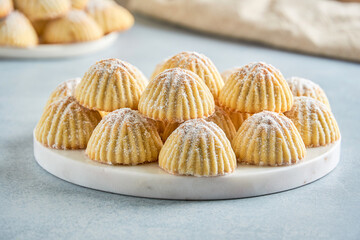 Arabic sweets. Traditional eid semolina maamoul or mamoul cookies with dates , walnuts and pistachio nuts . Close up