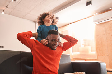 Son hugging his father at the living room