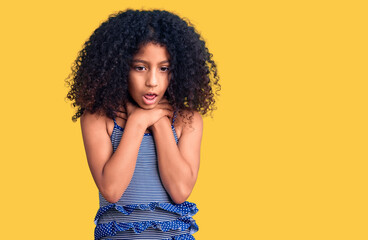 African american child with curly hair wearing swimwear shouting and suffocate because painful...