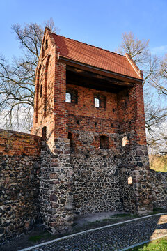 Medieval defensive walls with a tower in the city of Osno