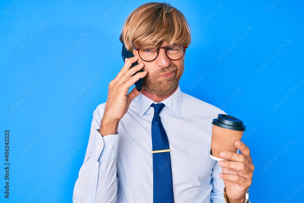 Poster Young blond man talking on the smartphone and drinking a cup of coffee skeptic and nervous, frowning upset because of problem. negative person.