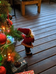 child decorating christmas tree