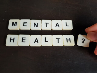 Mental health and wellness concept using alphabet tiles