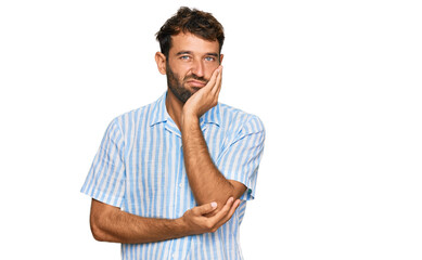 Handsome young man with beard wearing casual fresh shirt thinking looking tired and bored with depression problems with crossed arms.