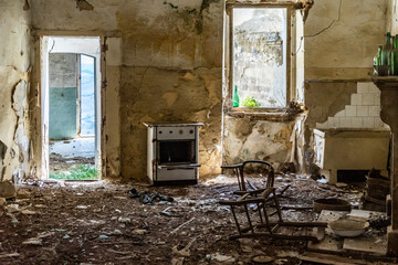 Interior of an abandoned house in Craco, a ghost town in the province of Matera abandoned due to a...