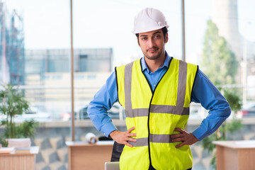 Young male architect working in the office