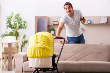 Young male contractor looking after new born at home