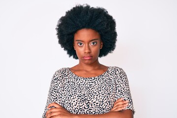 Young african american woman wearing casual clothes skeptic and nervous, disapproving expression on face with crossed arms. negative person.